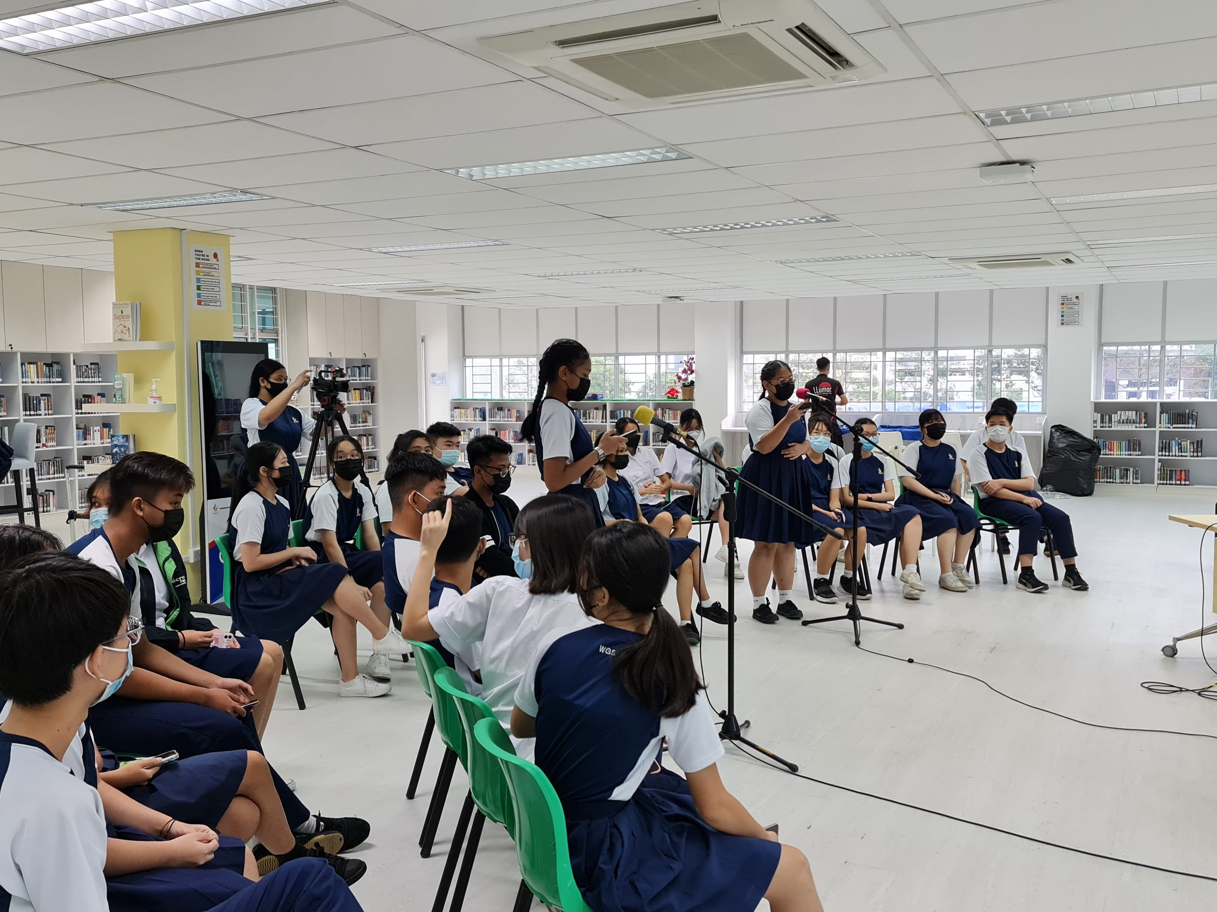 Students gather in a school library; for student forum